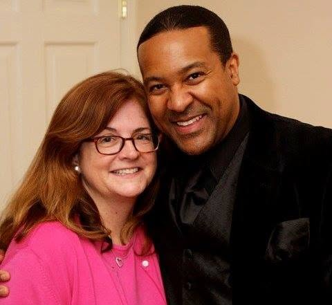 Kevin T. Robertson with a meeting planner after an event