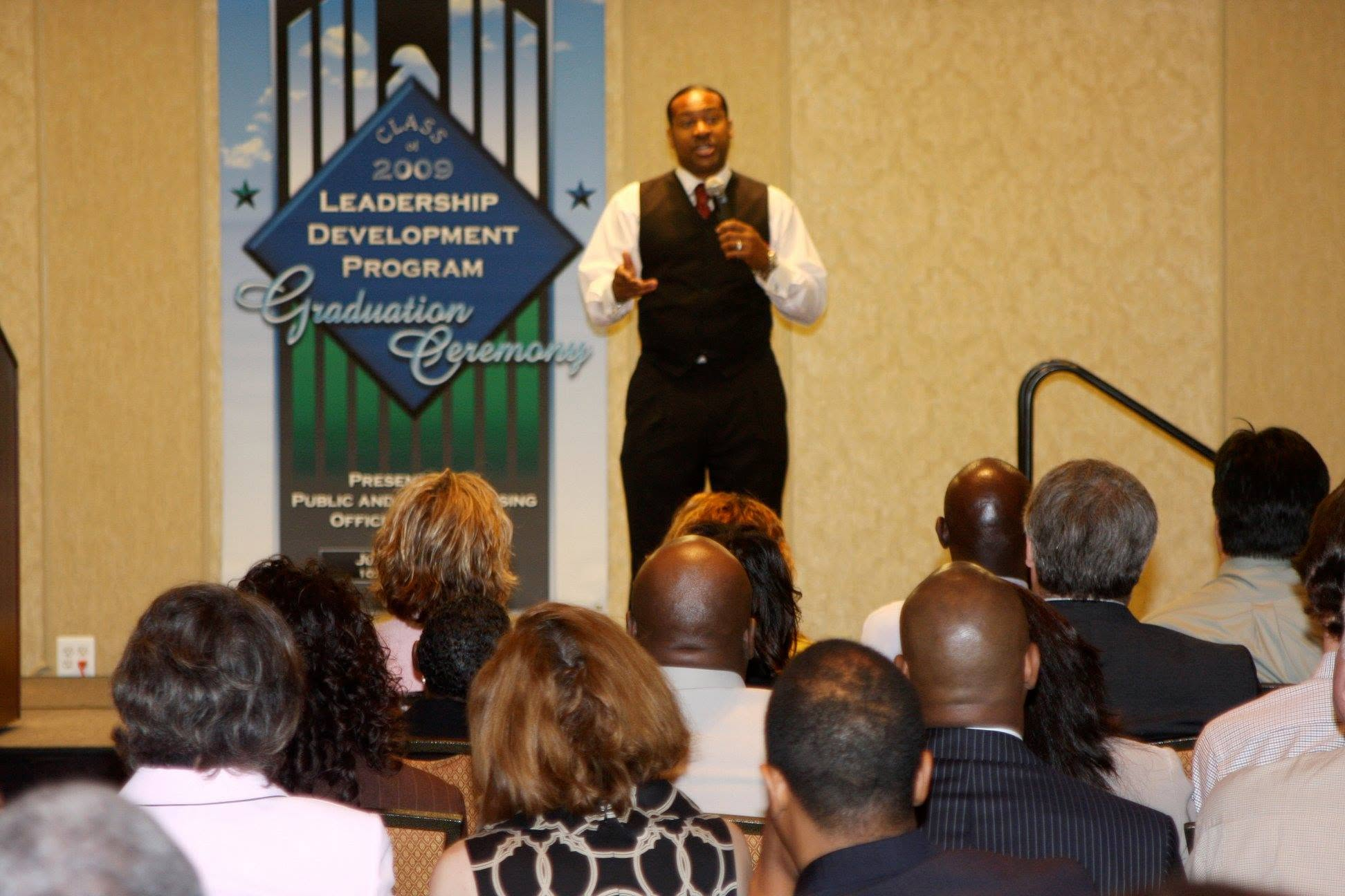 Kevin T. Robertson delivering leadership development training to a seated audience